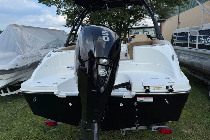 Slide: The Image of 2020 Hurricane SunDeck 191 OB boat with powerful outboard motor, parked on grass. - 3