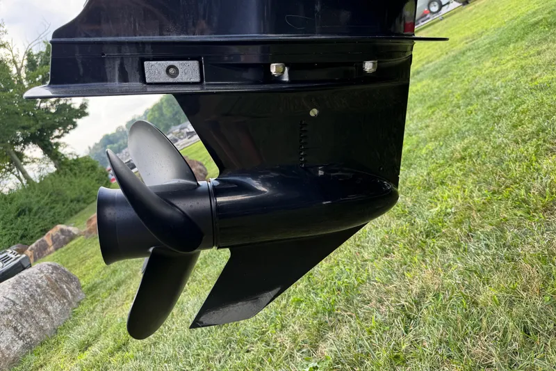 Slide: The Image of Close-up of a 2020 Hurricane SunDeck 191 OB boat propeller on grass. - 6