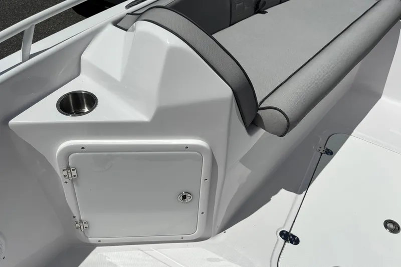 Slide: The Image of 2026 Glasstream 240 CCX boat interior with cushioned seating and storage compartment. - 14
