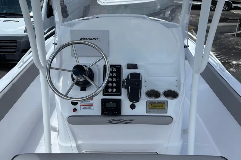 Slide: The Image of 2026 Glasstream 240 CCX boat console with Mercury steering and controls. - 7