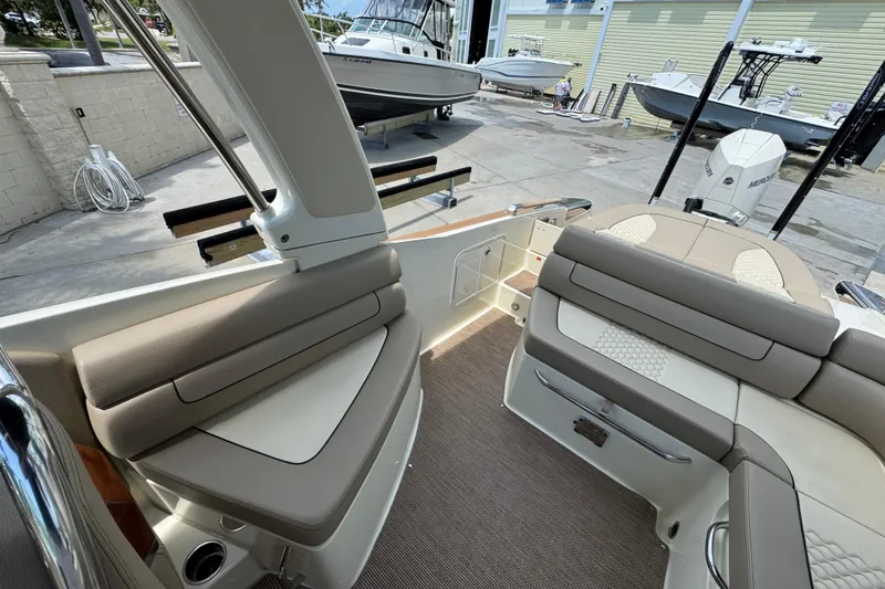 Slide: The Image of 2023 Chris-Craft Launch 25 GT interior with beige seating and modern design. - 17