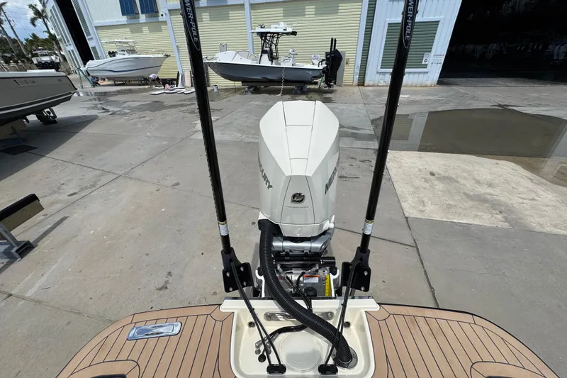 Slide: The Image of 2023 Chris-Craft Launch 25 GT with Mercury outboard engine at a marina. - 20