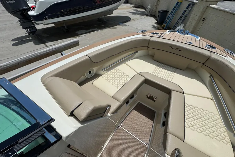 Slide: The Image of 2023 Chris-Craft Launch 25 GT boat interior with beige seating and elegant design. - 8