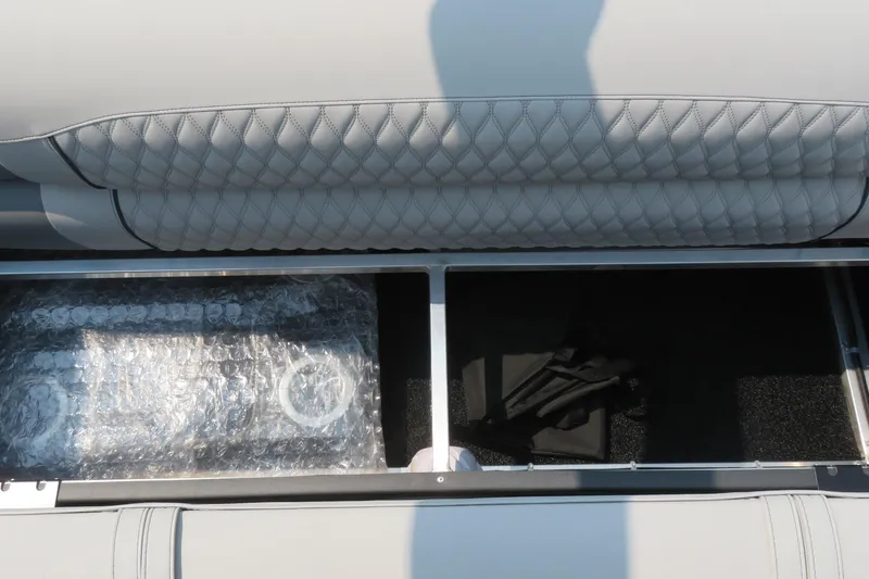 Slide: The Image of Storage compartment in Avalon 2785 Excalibur LTD Quad Lounger, showcasing interior details. - 19