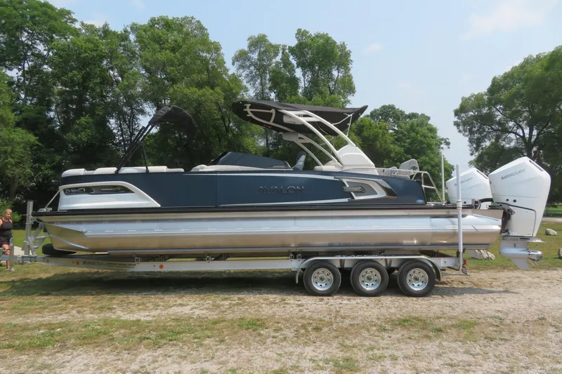 Slide: The Image of 2026 Avalon 2785 Excalibur LTD Quad Lounger Tri-toon on trailer, Sarasota, FL. - 2