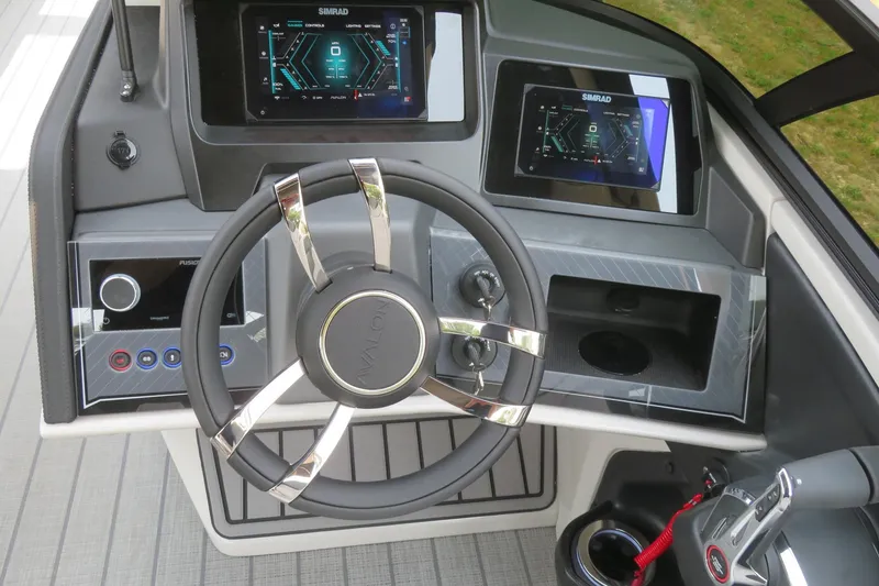Slide: The Image of 2026 Avalon 2785 Excalibur LTD boat dashboard with advanced controls and displays. - 26