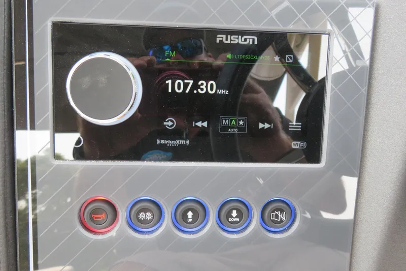 Slide: The Image of Fusion stereo system display on Avalon 2785 Excalibur LTD boat, showing 107.30 MHz frequency. - 29