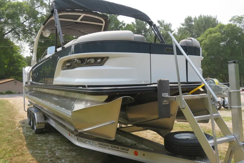Slide: The Image of 2026 Avalon 2785 Excalibur LTD Quad Lounger on trailer, Sarasota, FL, performance tri-toon boat. - 7