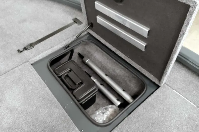 Slide: The Image of Storage compartment in 2025 Ranger ALPHA 208 boat, featuring organized equipment and accessories. - 17