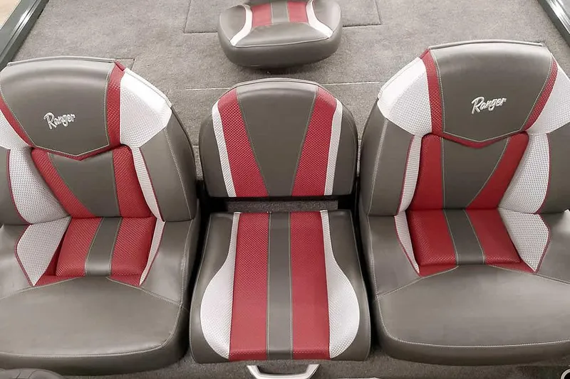 Slide: The Image of 2025 Ranger ALPHA 208 boat seats with red, white, and gray upholstery. - 23