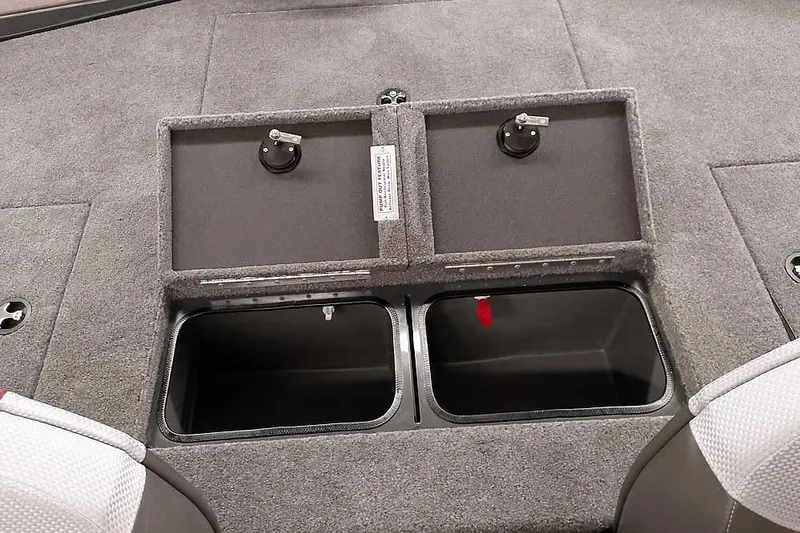Slide: The Image of Ranger ALPHA 208 2025 boat storage compartments with secure latches and carpeted finish. - 30