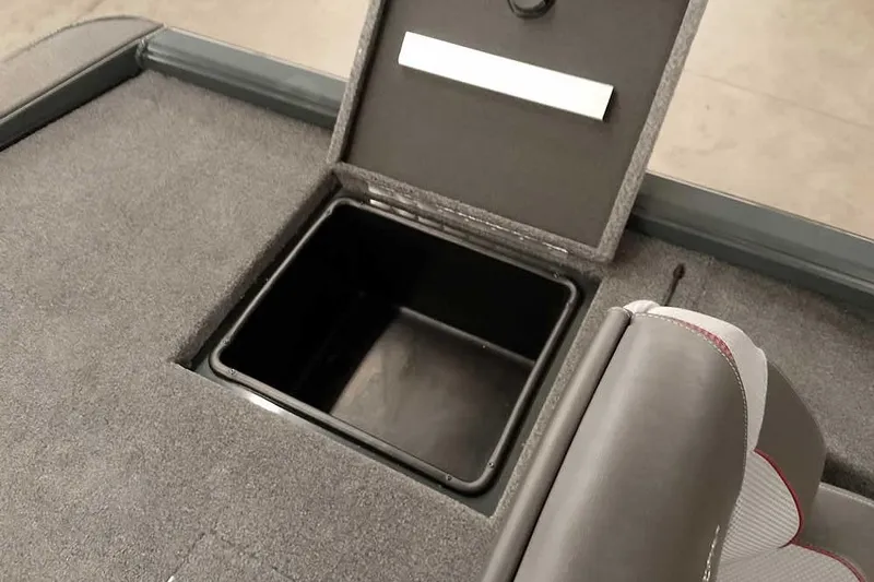 Slide: The Image of Ranger ALPHA 208 (2025) boat storage compartment with open lid and cushioned seating. - 31