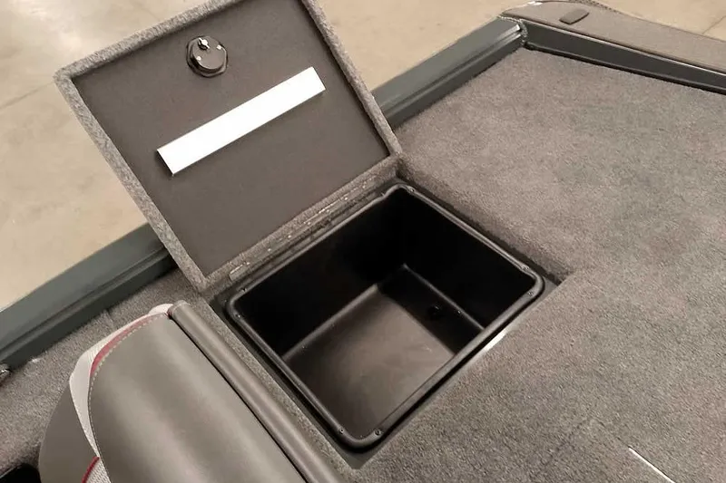 Slide: The Image of 2025 Ranger ALPHA 208 boat storage compartment with open lid, showcasing interior space. - 32