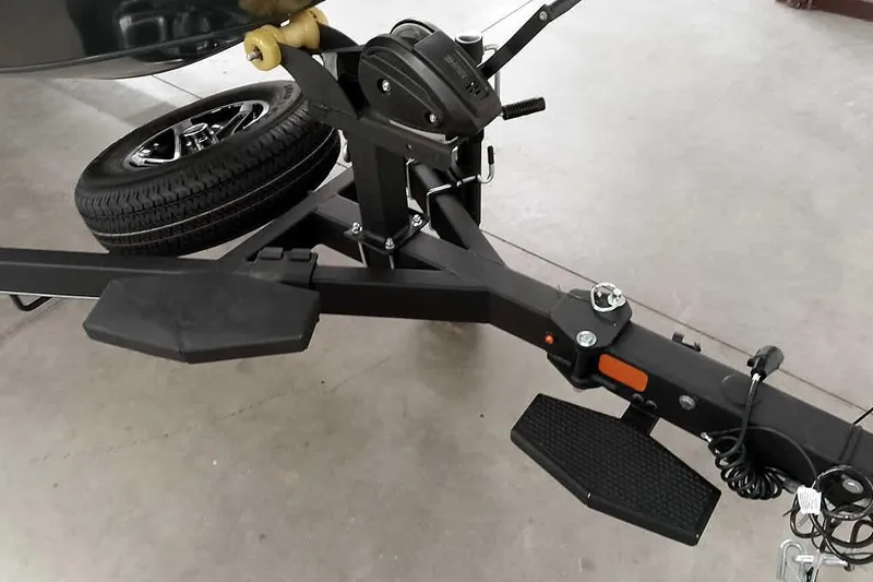 Slide: The Image of Trailer hitch of 2025 Ranger ALPHA 208 with spare tire and winch mechanism. - 37