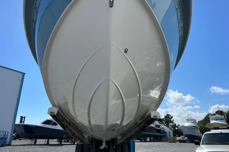 Slide: The Image of 2016 Everglades 243 Center Console boat on a stand, showing the outboard motor. - 19