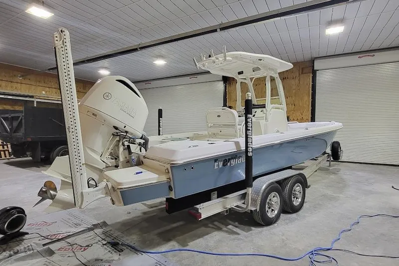 Slide: The Image of 2016 Everglades 243 Center Console boat on trailer in garage. - 21