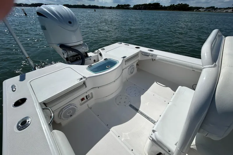 Slide: The Image of 2016 Everglades 243 Center Console boat cruising on water with Yamaha engine. - 4
