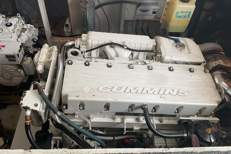 Slide: The Image of Engine room of a 1989 Torres 43 boat featuring a Cummins engine. - 6