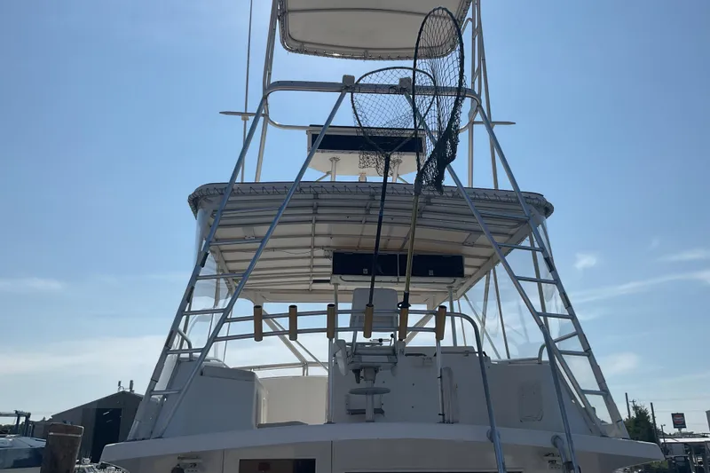 Slide: The Image of 1989 Torres 43 boat with fishing nets and upper deck, viewed from the rear. - 7