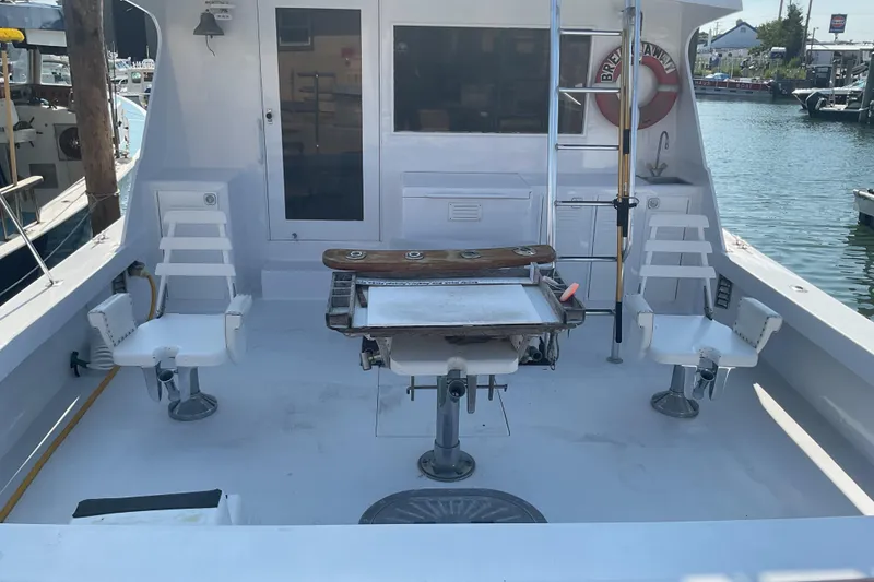 Slide: The Image of Fishing deck of a 1989 Torres 43 boat with chairs and equipment. - 8