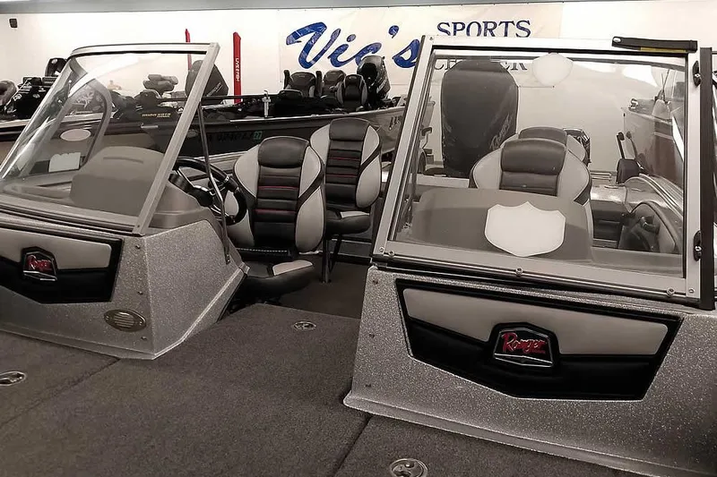 Slide: The Image of 2020 Ranger 1880MS Angler boat with dual windshields and seating, displayed indoors. - 10