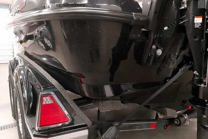 Slide: The Image of 2020 Ranger 1880MS Angler boat on trailer, close-up of rear and hull details. - 13