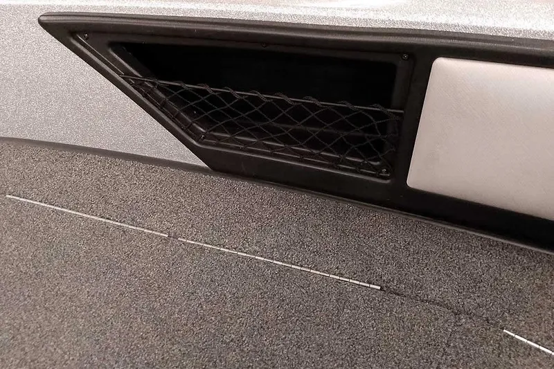 Slide: The Image of 2020 Ranger 1880MS Angler boat interior with storage compartment and netting. - 21