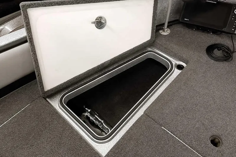 Slide: The Image of 2020 Ranger 1880MS Angler boat storage compartment with open lid. - 23