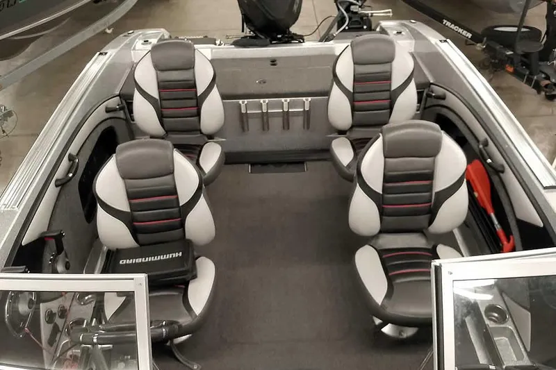 Slide: The Image of 2020 Ranger 1880MS Angler boat interior with four cushioned seats and fishing rod holders. - 27