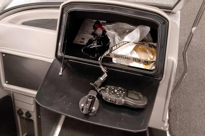 Slide: The Image of Glove compartment of 2020 Ranger 1880MS Angler boat with remote control and accessories. - 30