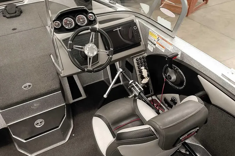 Slide: The Image of 2020 Ranger 1880MS Angler boat interior with steering wheel and dashboard controls. - 33
