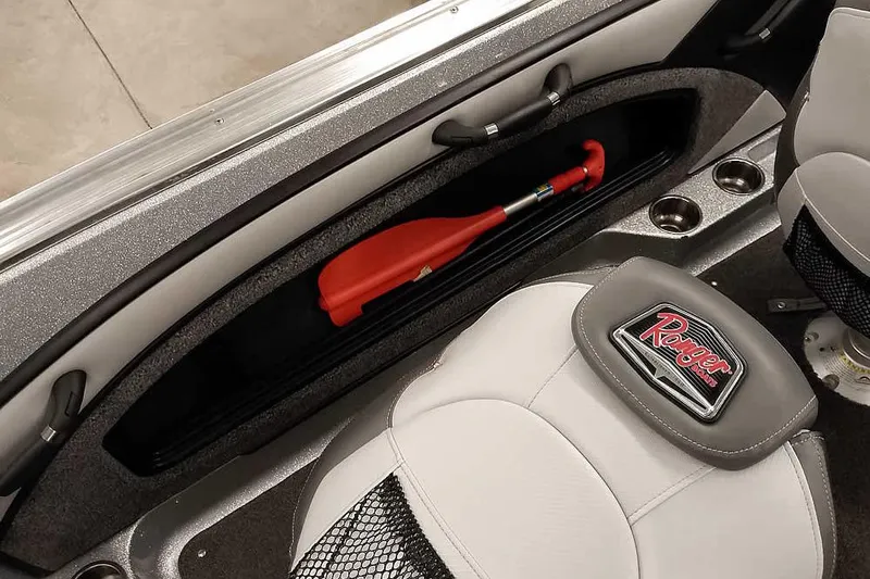 Slide: The Image of 2020 Ranger 1880MS Angler boat interior with storage compartment and paddle. - 37