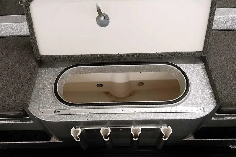 Slide: The Image of 2020 Ranger 1880MS Angler boat livewell with measuring ruler and rod holders. - 43