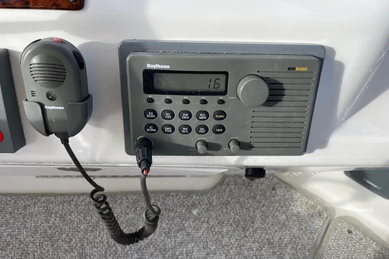 Slide: The Image of Raytheon marine radio on 2000 Sea Ray 400 Sedan Bridge yacht dashboard. - 10
