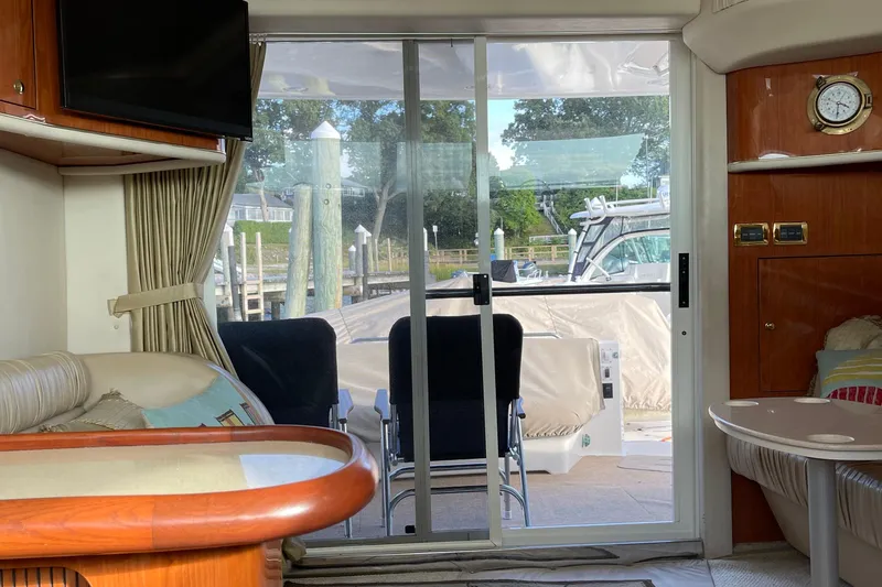 Slide: The Image of Interior view of 2000 Sea Ray 400 Sedan Bridge yacht with sliding glass door. - 19