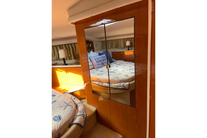 Slide: The Image of Interior of 2000 Sea Ray 400 Sedan Bridge with cozy bedroom and mirrored closet. - 27