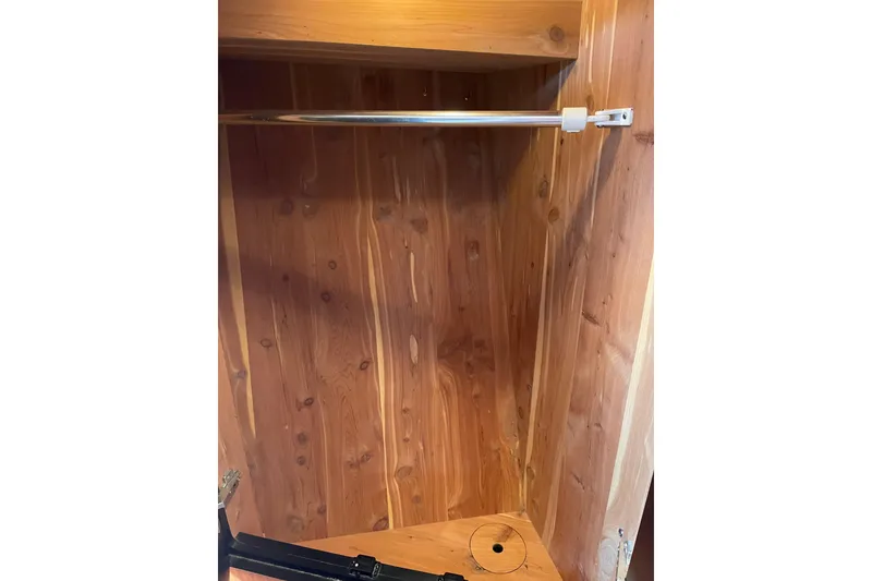 Slide: The Image of Wooden closet interior on a 2000 Sea Ray 400 Sedan Bridge yacht. - 29