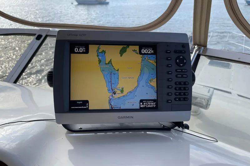 Slide: The Image of Garmin GPS on 2000 Sea Ray 400 Sedan Bridge, displaying nautical map. - 7