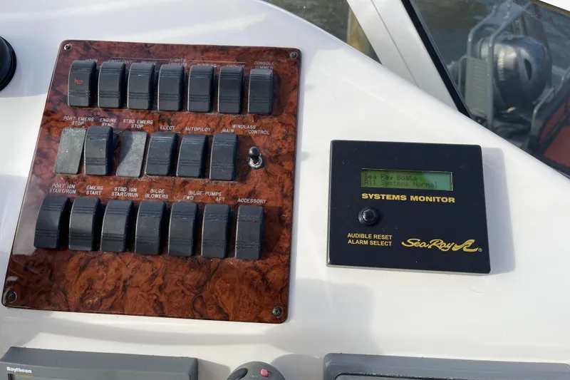Slide: The Image of Control panel of a 2000 Sea Ray 400 Sedan Bridge with systems monitor display. - 9