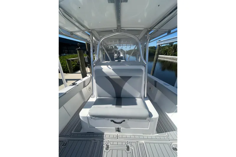 Slide: The Image of 2004 SeaVee 340B boat interior with cushioned seating and sleek design. - 14
