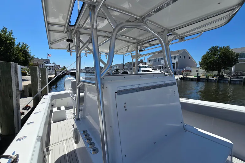 Slide: The Image of 2004 SeaVee 340B boat docked in a scenic waterfront neighborhood. - 20