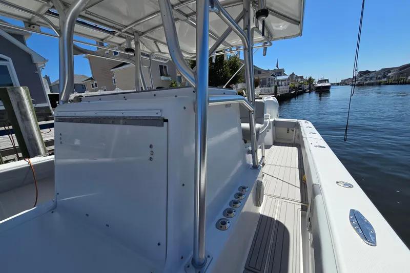 Slide: The Image of 2004 SeaVee 340B boat docked in a scenic canal setting. - 21