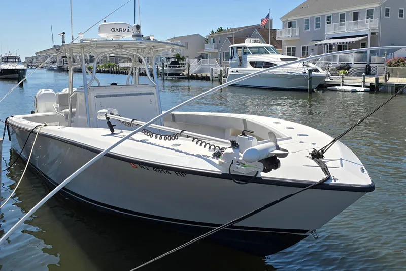 Slide: The Image of 2004 SeaVee 340B boat docked in a marina, featuring a Garmin radar system. - 5