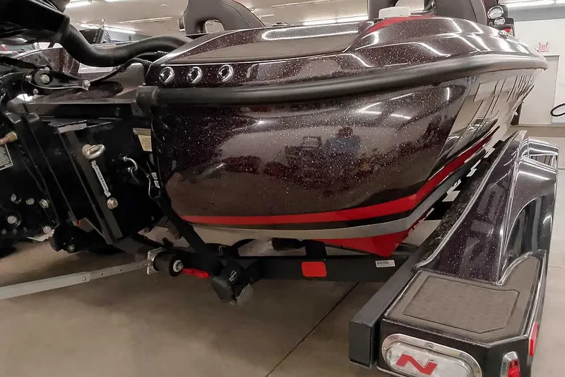 Slide: The Image of 2022 Nitro Z19 SC boat on trailer, showcasing sleek design and metallic finish. - 17