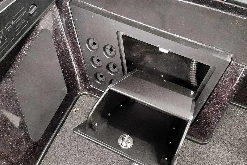 Slide: The Image of 2022 Nitro Z19 SC boat storage compartment with organized interior layout. - 27