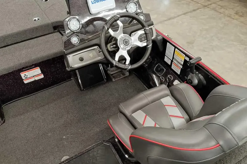 Slide: The Image of 2022 Nitro Z19 SC boat interior with steering wheel and seating. - 29