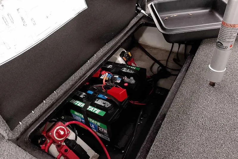 Slide: The Image of 2022 Nitro Z19 SC boat battery compartment with Interstate batteries and wiring. - 37