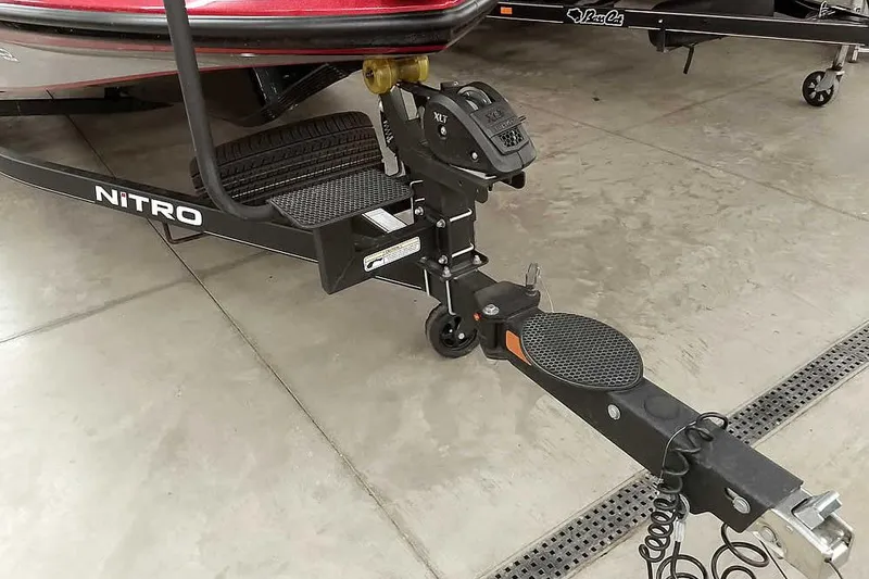 Slide: The Image of 2022 Nitro Z19 SC boat trailer hitch and step detail in a showroom. - 39