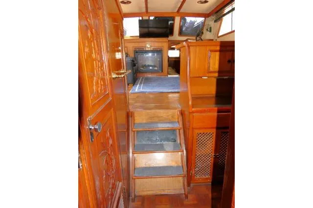 Slide: The Image of Interior of 1983 CHB 45 boat with wooden stairs and cabinetry. - 19