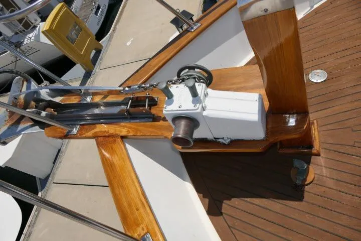 Slide: The Image of 1983 CHB 45 boat deck with wooden finish and mechanical equipment. - 53
